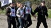 Ադրբեջանցի Armenia -- International Committee of the Red Cross officials carry their flag as they follow Armenian servicemen escorting Eldar Tagiyev, an Azerbaijani hostage, near the village of Kayan, 04Nov2010