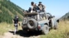 Группа волонтеров выдвигается на место начала поисковой операции в Аксайском ущелье на месте массового убийства. 18 августа 2012 года.