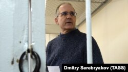 Paul Whelan stands inside a defendants' cage as he attends a court hearing regarding the extension of his detention in Moscow on May 24.