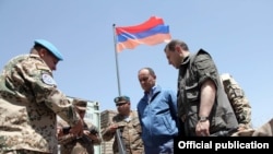 Armenia -- Defense Minister Seyran Ohanian inspects Armenian troops in Afghanistan, 24July 2010.