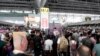 Stranded passengers wait at Bangkok's Suvarnabhumi International Airport on February 28 after Thai Airways canceled 11 European-bound flights.