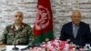 Кызматтан алынган коргоо министри Абдулла Хабиби менен Армиянын штаб башчысы Кадам Шах Шахим