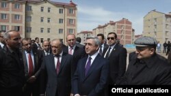 Armenia - President Serzh Sarkisian and Gyumri Mayor Vartan Ghukasian (R) inspect new apartment blocks constructed in Armenia's second largest city, 7Apr2012. 