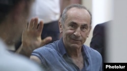 Armenia -- Former President Robert Kocharian waves to supporters during his trial, Yerevan, September 20, 2019.