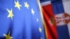 Serbia -- Serbian (R) and EU flags are seen inside a shop in Belgrade, 08Dec2011